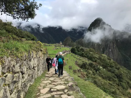 Two people walking the Inca Trail on a Traveling Professor Machu Picchu Tour to Peru and the Amazon